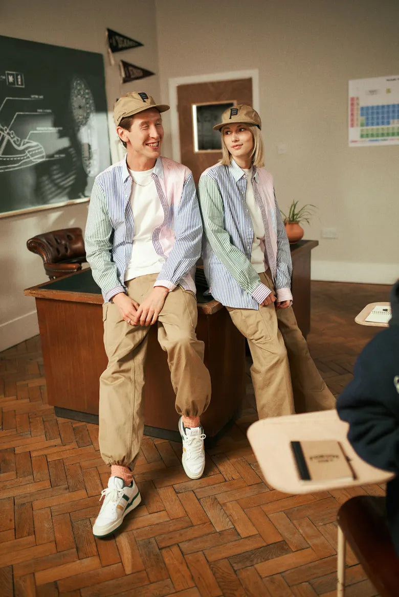 People in a classroom wearing the END. x Beams Plus Varsity collection.